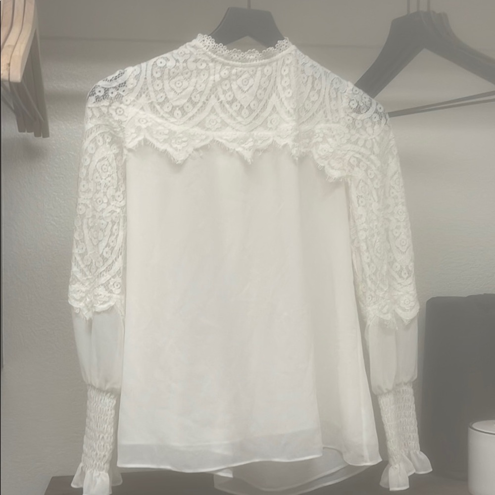 White mock neck long sleeved blouse